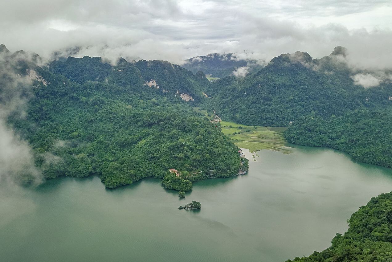 Ba Be Lake in Northern Vietnam surrounded by limestone mountains